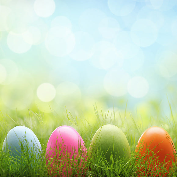 Row of Easter eggs in Fresh Green Grass